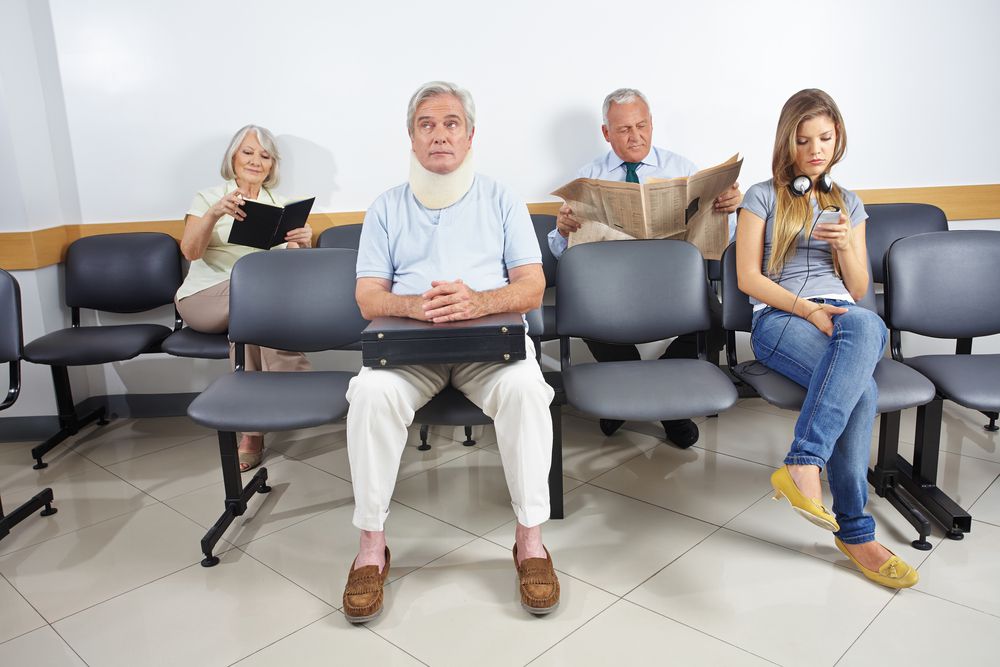 group of patients wait for medical care in urgent care clinic